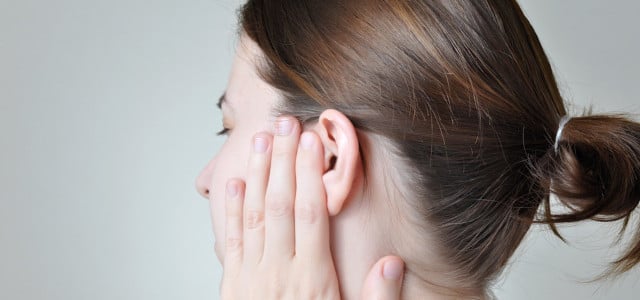 clogged ears remedy woman pain