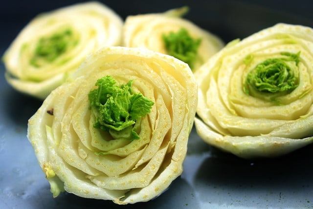 When lettuce leaves start to regrow, they form a bud in the center of the lettuce base.