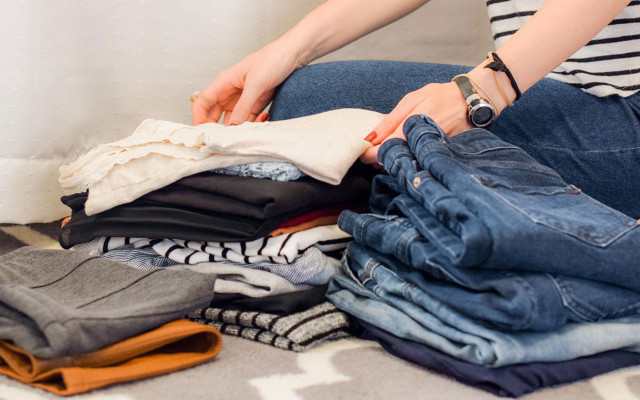 Minimalist closet clearing sorting clothes